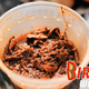 Leftover birria in plastic tub